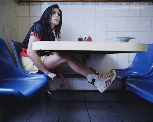 themightyboosh:Amy Winehouse photographed in a London café in