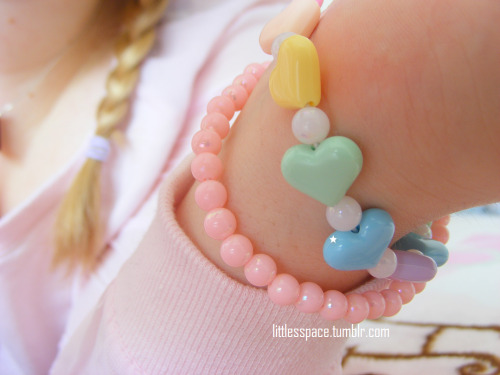 littlesspace:  I love my pink shirt. And my I LOVE DADDY paci. And my rainbow-heart necklace, that I prefer wearing as a bracelet, so I can see it, hehehe. (Diaper: Tena FeelDry Slip Plus, Size L) 