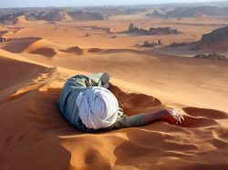 natgeotravel:  Nap time. A Tuareg guide rests at the summit