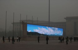 xantime:A bright video screen shows images of blue sky on Tiananmen