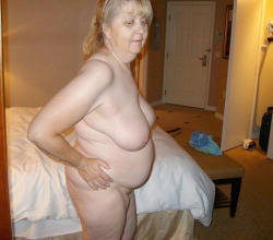 An older lady with a hanging fat belly. Who wants to bed her?More