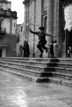  Ferdinando Scianna Sicily, Bagheria:Boy jumping on the stairs