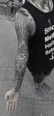 Geometric stippled tattoo by Kenji Alucky