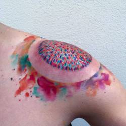 tattoofilter:  Abstract circle tattoo on the left shoulder. Tattoo