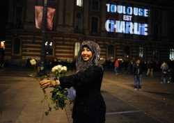 stunningpicture:  A muslim girl distributing flowers in France