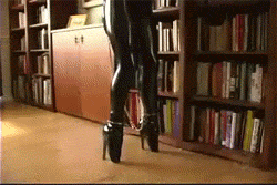 rubberdollowner:  http://rubberdollowner.tumblr.com I just love the predicament of this Gif series.  Ballet boots, legs chained, arms in bondage and she’s dusting away! Now to do the white glove test afterwards and have her repeat it all over again