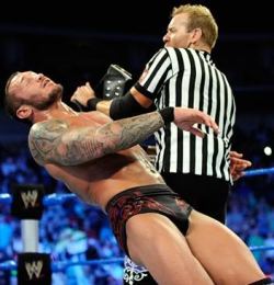 Orton bulging, after getting hit with the world title! Must like