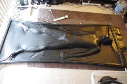 rbbrkink:rubbertopboys:A boy all sealed in rubber!!!   Love