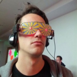 lasergrey:  Xander was excited, going through the convention. All the latest gadgets, games and more. He stopped at a stall with some funky looking glasses. The attendant told him it was similar to the Oculus Rift, making the wearer truly believe he was