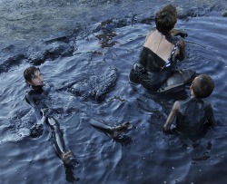 absolvd:  A family bathing in crude oil 