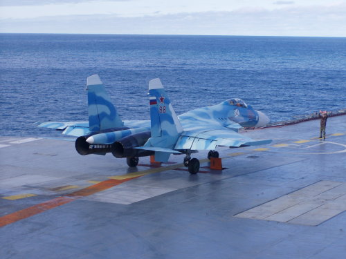 planesawesome:   The Su-33 being navigated before take off  