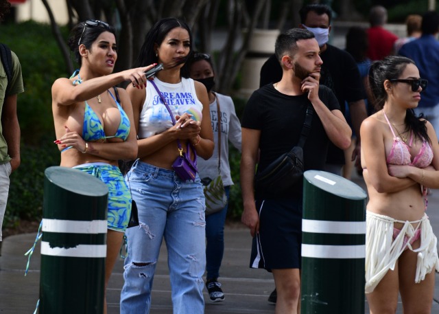 Hard to notice the pokie on the girl in white with such massive