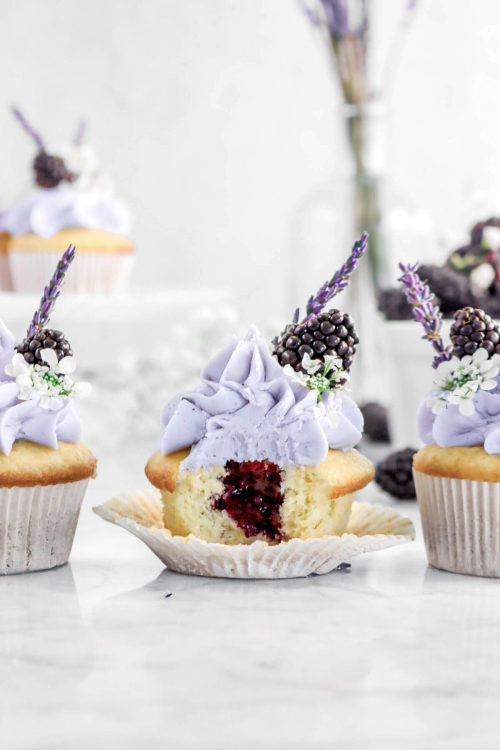 fullcravings:Vanilla Cupcakes with Blackberry Jam Filling and