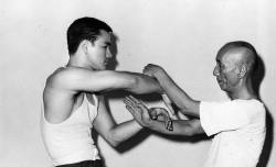 sickwidit:  Bruce Lee sparring with Ip Man 1955