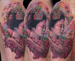 tattoofilter:  Geisha tattoo on the right upper arm and shoulder.