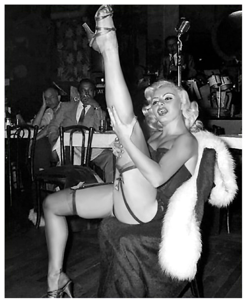 Rita Grable Busts a few moves, during a performance at an unidentified 50’s-era nightclub..