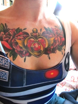 fuckyeahgirlswithtattoos:  Chest piece featuring one of the pendants