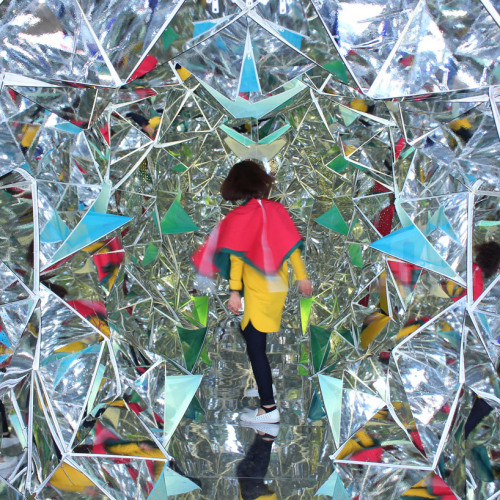 exhibition-ism:  Installation by designers Â Masakazu Shirane   Saya Miyazaki entitled â€˜Winkâ€™ invites visitors to enter the life size kaleidoscope built inside of a 40 ft long shipping container.Â  