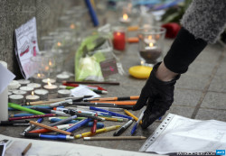 afp-photo:  FRANCE, Strasbourg : A woman places a pen in the