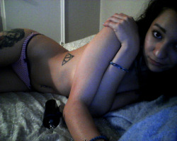 xxMiranda takes a quick self shot in her bed.