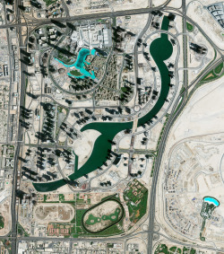 dailyoverview:  The skyscrapers of Dubai cast long shadows over