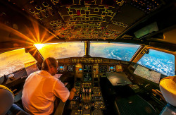 sixpenceee:  A sunrise 35,000 feet above the Indian Ocean 