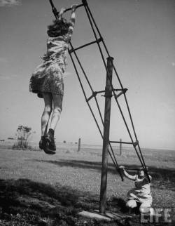 bygoneamericana:  Children playing on a see-saw at recess. Illinois,