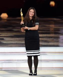 Chinese tennis star Li Na receiving the award for Best Female