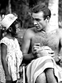  Sean Connery signing a coconut for a little Jamaican fan on