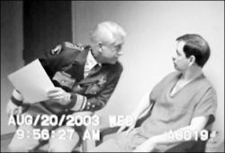 starving-cannibal:  Sheriff Dave Reichert, left, stares at Green