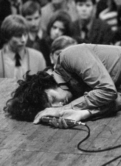 babeimgonnaleaveu:Jim Morrison passes out on stage during a performance