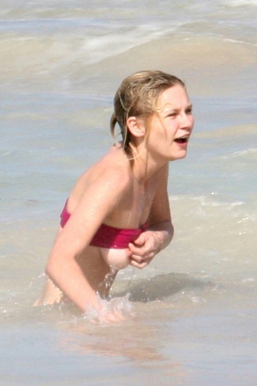 Kirsten Dunst falls out of her bikini top in St. Bartâ€™s, Caribbean (January 2005)