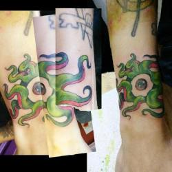 Recent tattoo of an eyeball tentacle monster. Wraparound on the