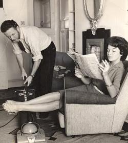 men-doing-housework:  Here, a man vacuums while his wife educates