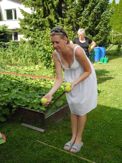 This is my aunt Alice out in her garden. She has been flirting with me sexually for several months. I am hoping that I can fuck her soon.