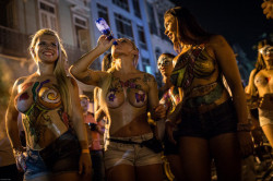 Topless and body painted at a Brazilian carnival, by sicilia