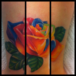 fuckyeahtattoos:  rainbow rose tattoo done by Alisa King of Serious