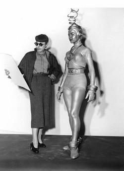 atomic-flash:  Designer Edith Head with her space-age creation,