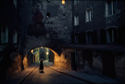 natgeofound:  Saint Christopher decorates an archway over a cobblestone