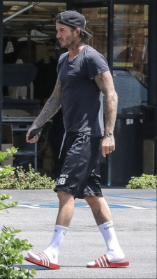 thongfaggot: David Beckham cruisin around in socks & slides….