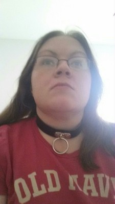 taken113002:  My wife wearing her collar and self gagging with