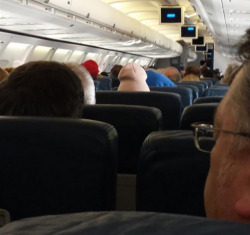textpoops:  This person sitting a few rows ahead of me on the