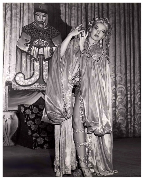 Lili St. Cyr        (aka. Marie Van Schaack)  Promotional photo series featuring the costume used in her “Chastity Belt” dance routine.. 