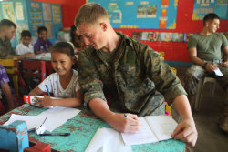  Marine pretending to cheat off a 4th graders math exam. - Phillippines