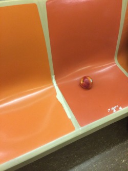 lateaugust1998: Spotted on the subway, a lone nectarine on an