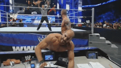 Randy bending Cesaro over the announce table…its exactly what