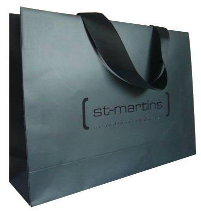 <p><a href="http://www.wholesalegiftboxes.org">Luxury paper bags with uv logo and ribbon handle</a> from Gift Boxes Mart,this bag is made of 230g art paper,with black color 100% printing as background,matt lamination,feature with spot uv varnish logo and ribbon handle slotted into top.Usually those paper bags with ribbon handle and uv spot varnish are considered as luxury bags,because they are not only expensive,but do have elegant and luxurious looking and feeling.when you provide those luxury paper bags to your customers to carry what they purchase,your luxury paper bags can add more value and quality feel to your products,that will add more confidence on your business.As luxury paper bags manufacturer,Gift Boxes Mart specialize in manufacturing quality luxury paper bags,we offer huge slections of handle and finishes such as die cut handle,ribbon handle,hot stamping,embossing,uv,eyelet to make your bags more distinctive,detail please go <a href="http://www.wholesalegiftboxes.org">http://www.wholesalegiftboxes.org</a><br/></p>