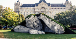 mymodernmet:  A gigantic man crawls out from the earth in this