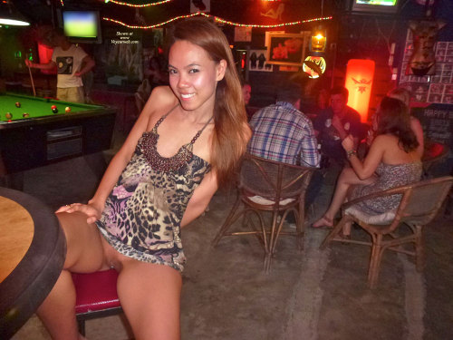 peepys-roadrunner:  Skinny little Asian slut exposing her shaved and pierced pussy in public. 