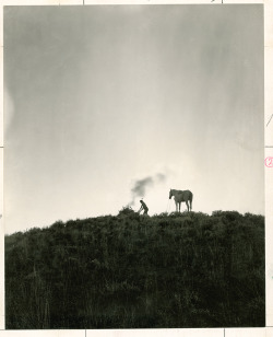 A Native American sends smoke signals in Montana, June 1909.Photograph